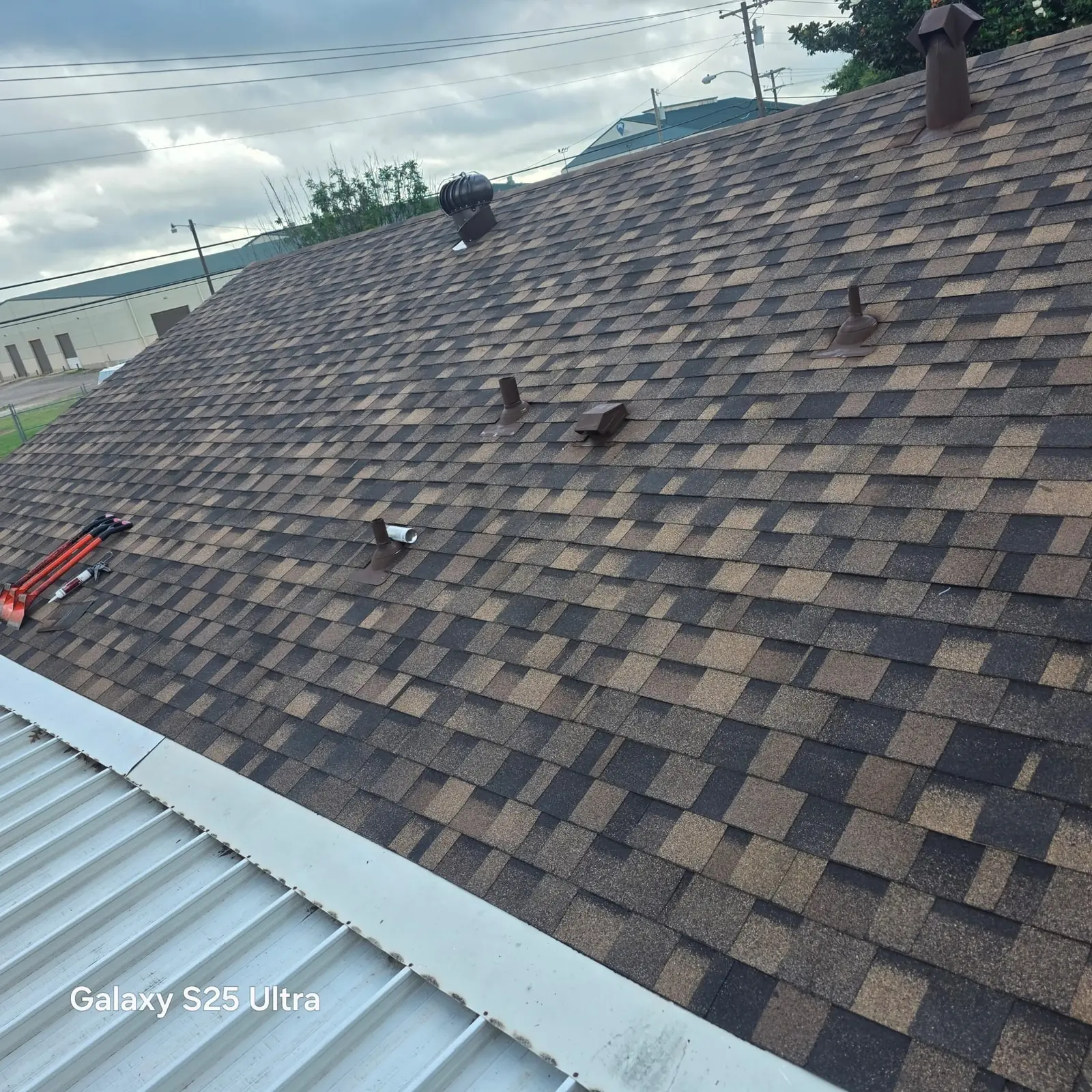 Close view of a shingle roof fitted by ACS Roofing and Exteriors