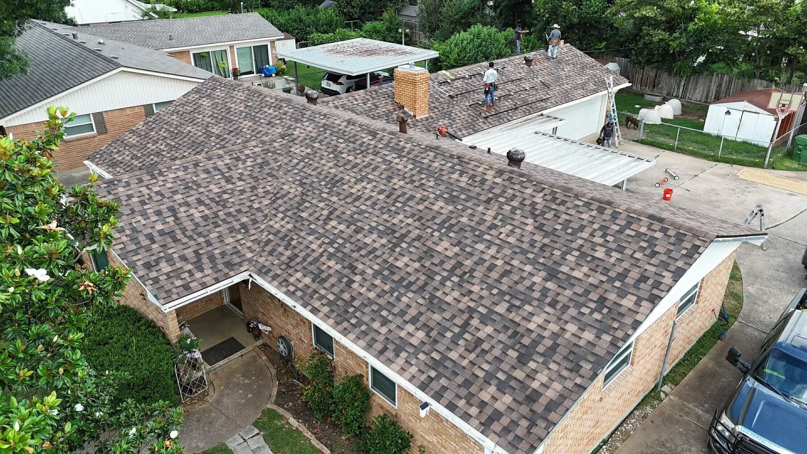 A worn shingle roof on a Waco home photographed from above before work starts