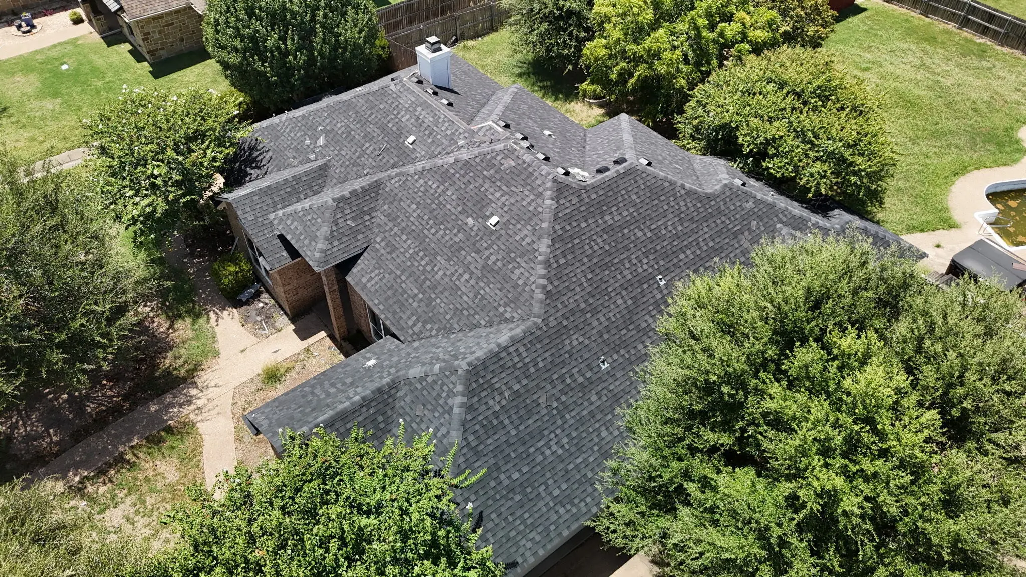 A completed roof replacement on a Waco home, photographed from above