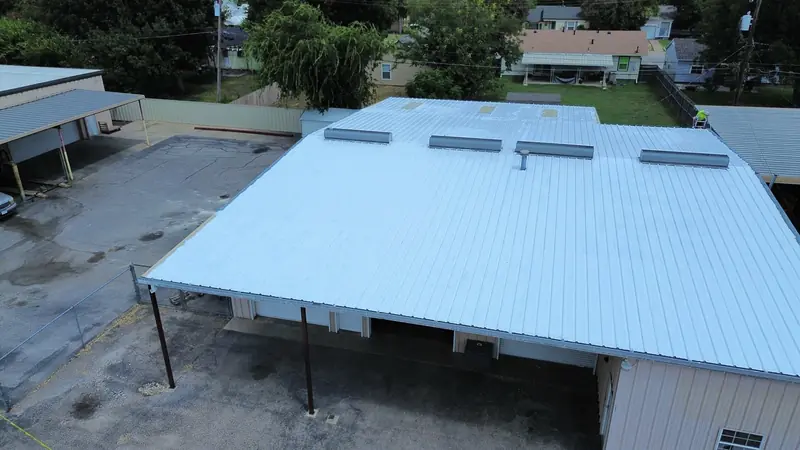 Commercial roof coating finished on a flat roof, from above