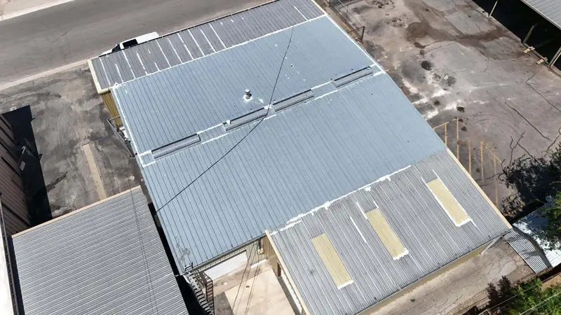 Commercial metal roof before coating, from above