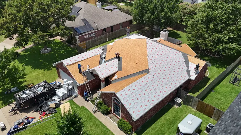 Underlayment laid across a stripped roof before shingles